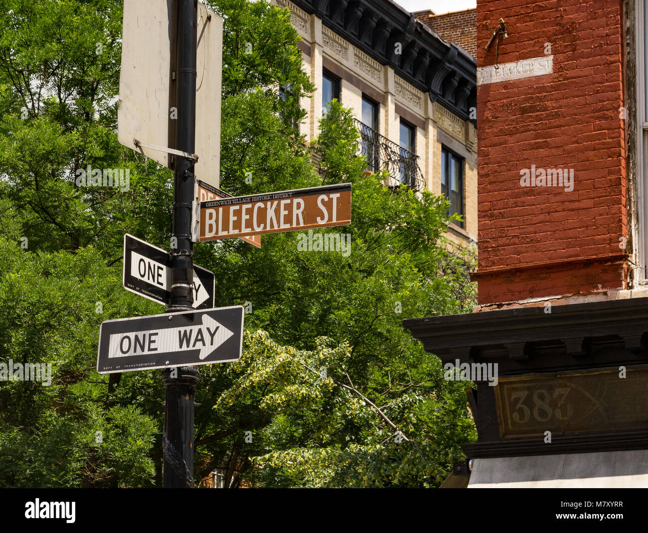 Brown Bleecker St street sign and a one way street sign In Greenwich Village, Manhattan, New York Stock Photo