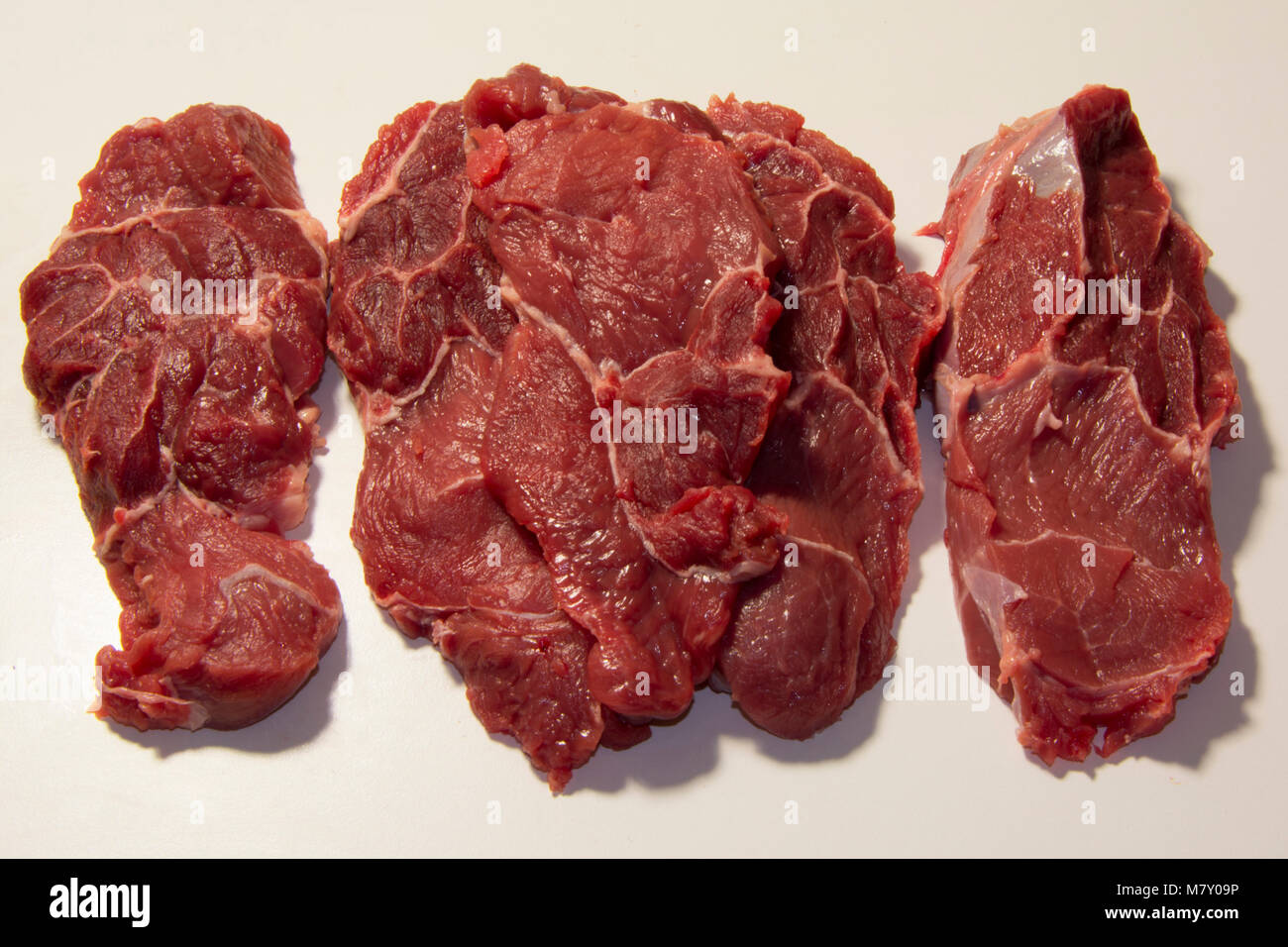Equino steak raw meat on white background Stock Photo