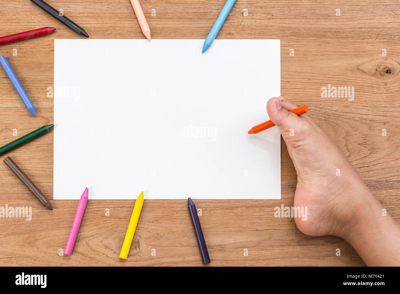 Blank of white paper and right foot of disabled people with color