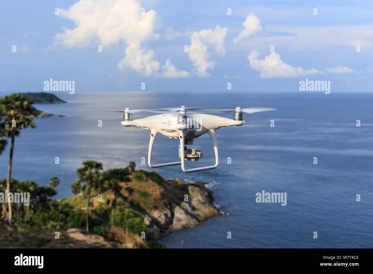 PHUKET, THAILAND - MAY 9 : Drone quadcopter Dji Phantom 4 Pro with 4K digital camera while flying over the sea in Phuket on May 9, 2017. Stock Photo