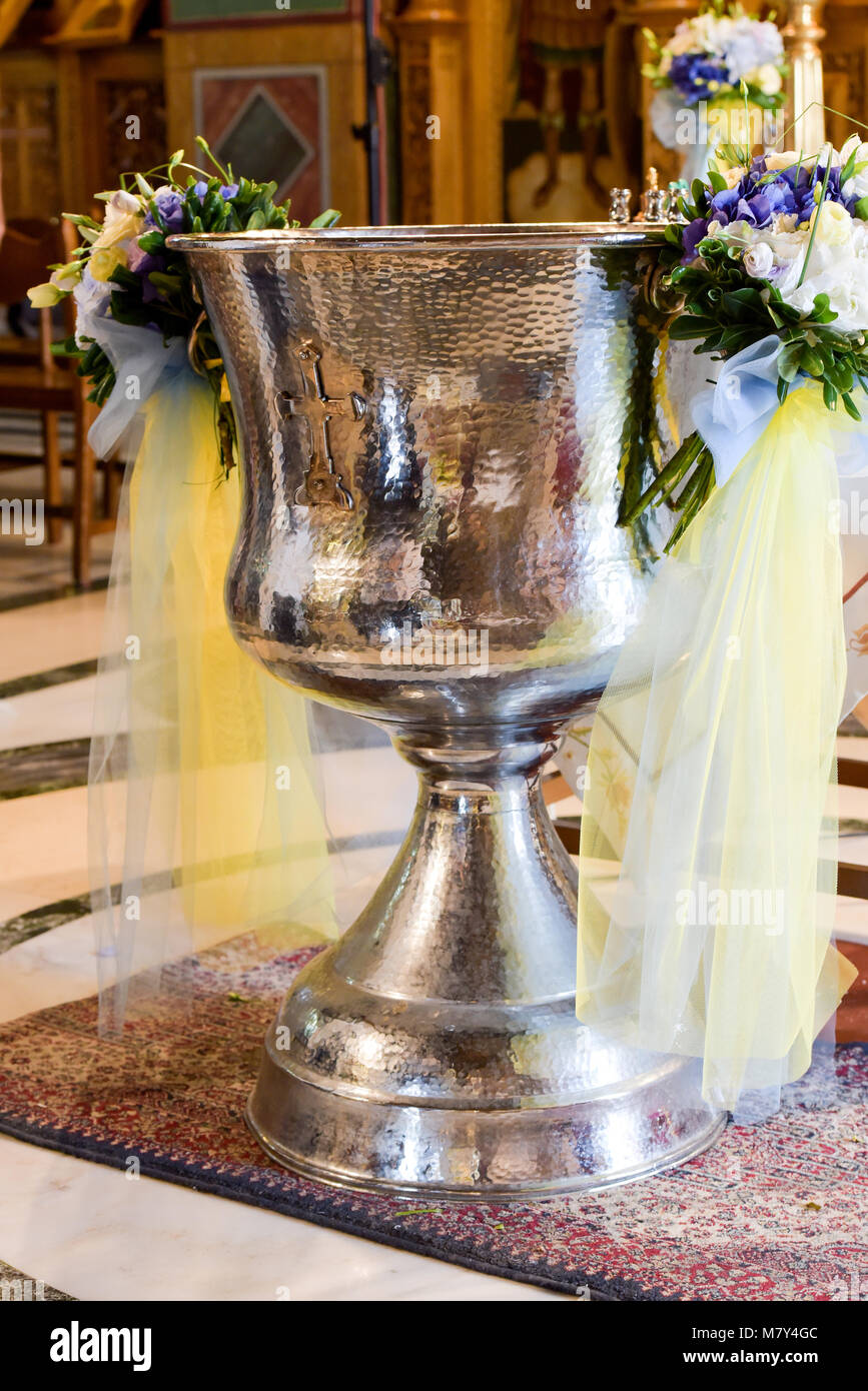 Orthodox Baptism Bowl prepared for christening ceremony in greek church