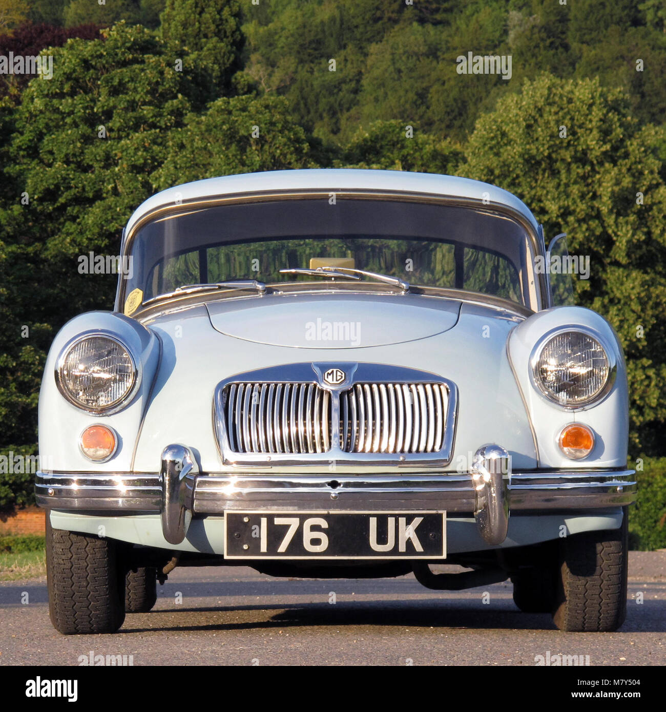 classic MGA Coupe in iris blue, front view on bight sunny evening Stock Photo