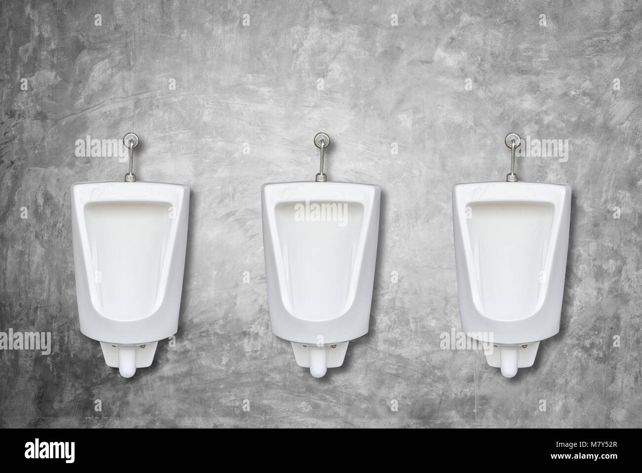 New row of ceramic outdoor urinals in men public toilet install on the wall Stock Photo Alamy