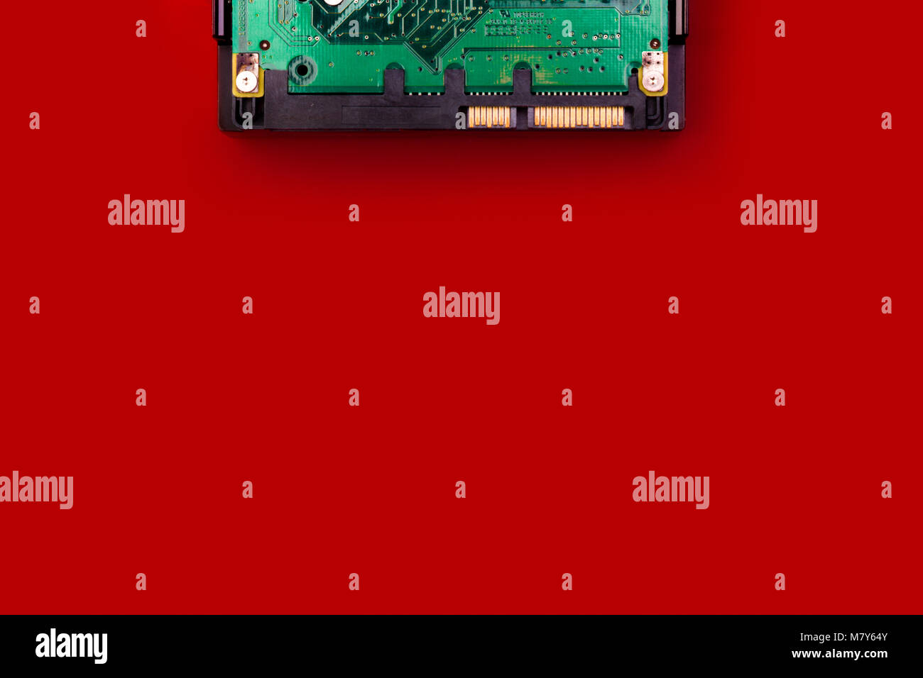 Hard drive on a red background, top view, with space for your text ...