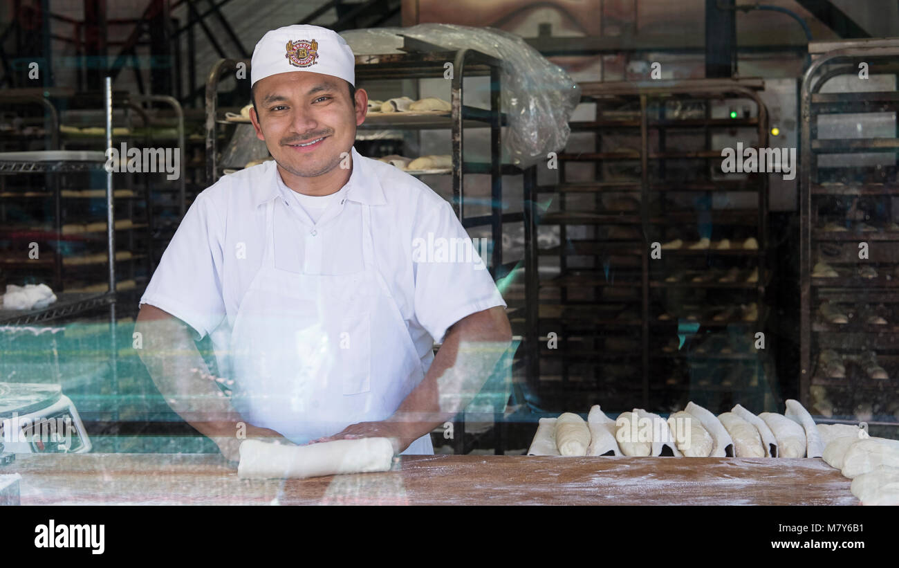 Fisherman's Wharf, San Francisco, California - September 23, 2017: Male baker smiling and preparing the famous sourdough bread at Boudin Bakery Stock Photo