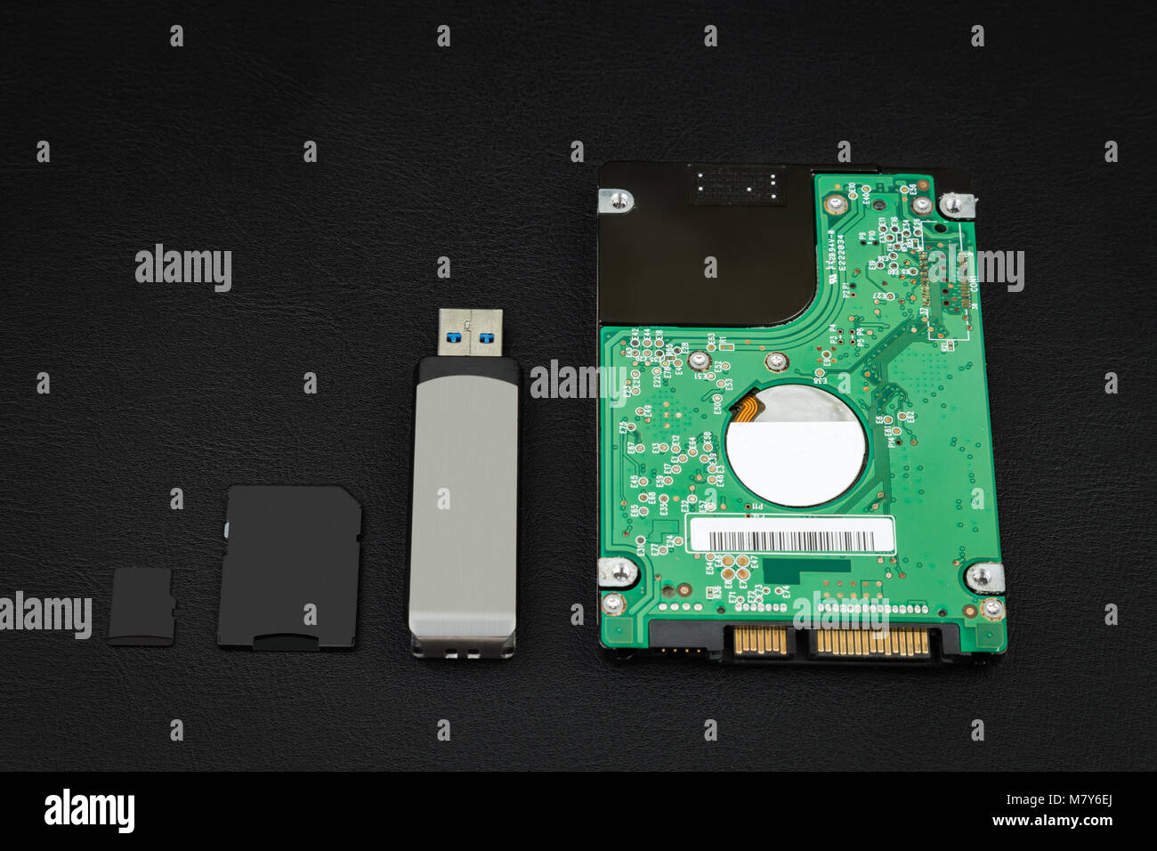 Hard disk, Usb flash drive, SD card and micro SD on the black