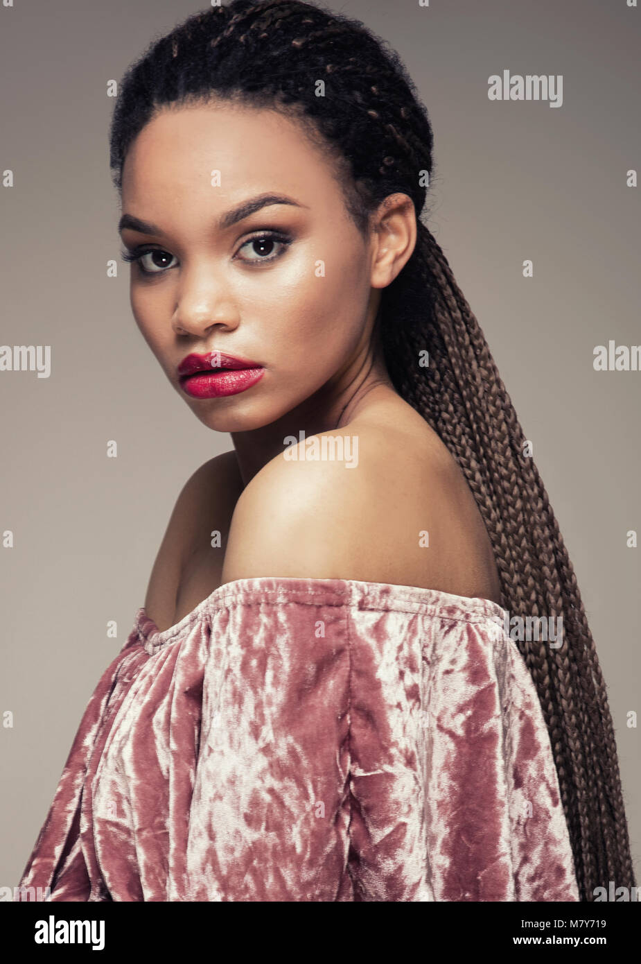 Beautiful african american girl looking at camera Stock Photo - Alamy