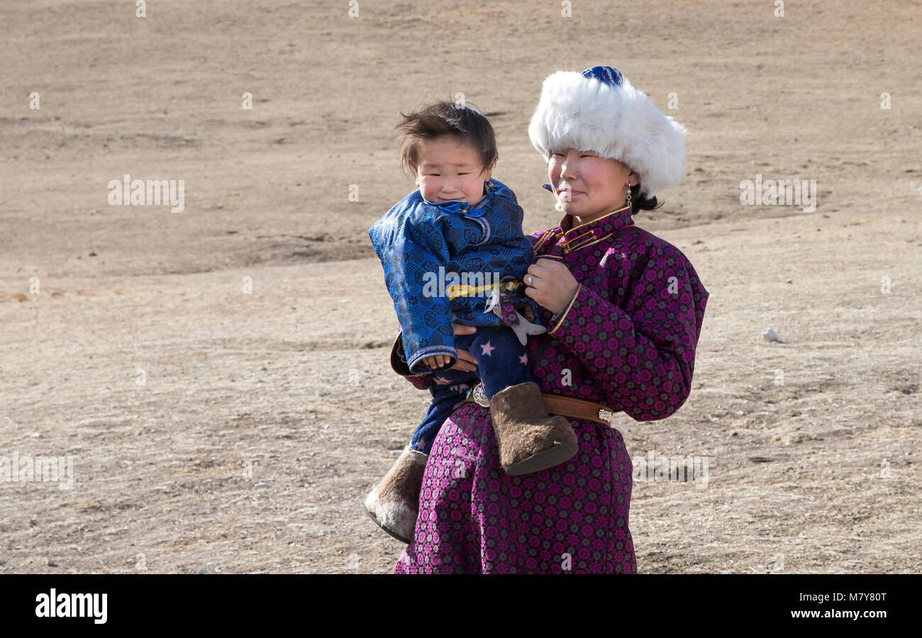 Hatgal, Mongolia, 2nd March 2018: mongolian woman with her baby in northern Mongolian steppe Stock Photo