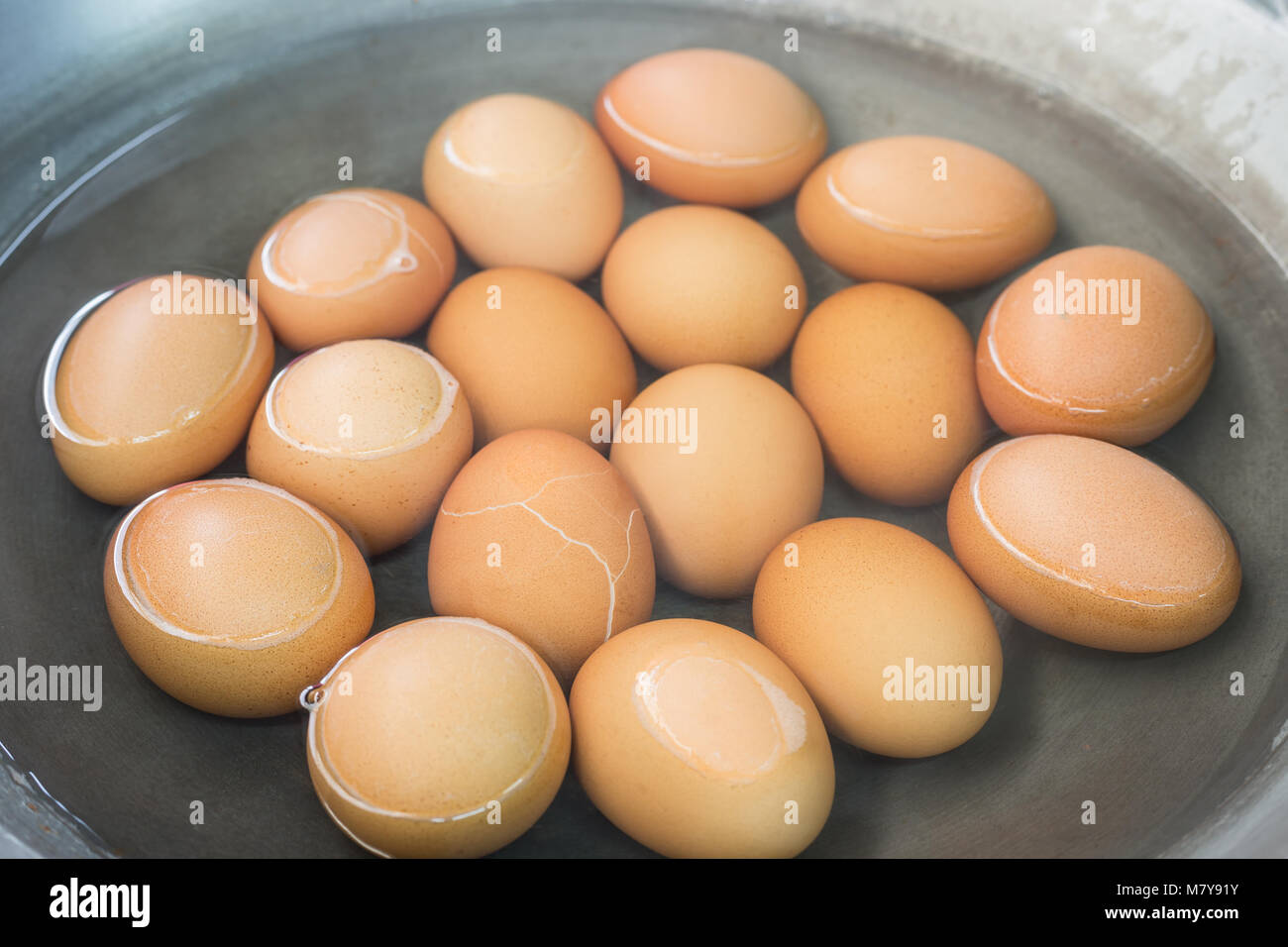 Close up boiled eggs in pan with hot water Stock Photo