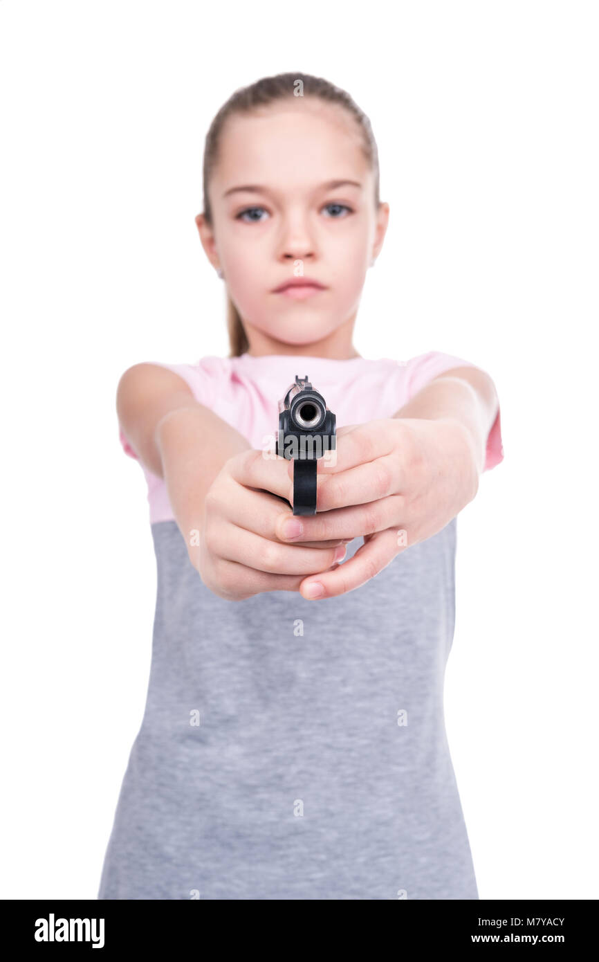 Young girl aiming a gun at the camera, isolated on a white background