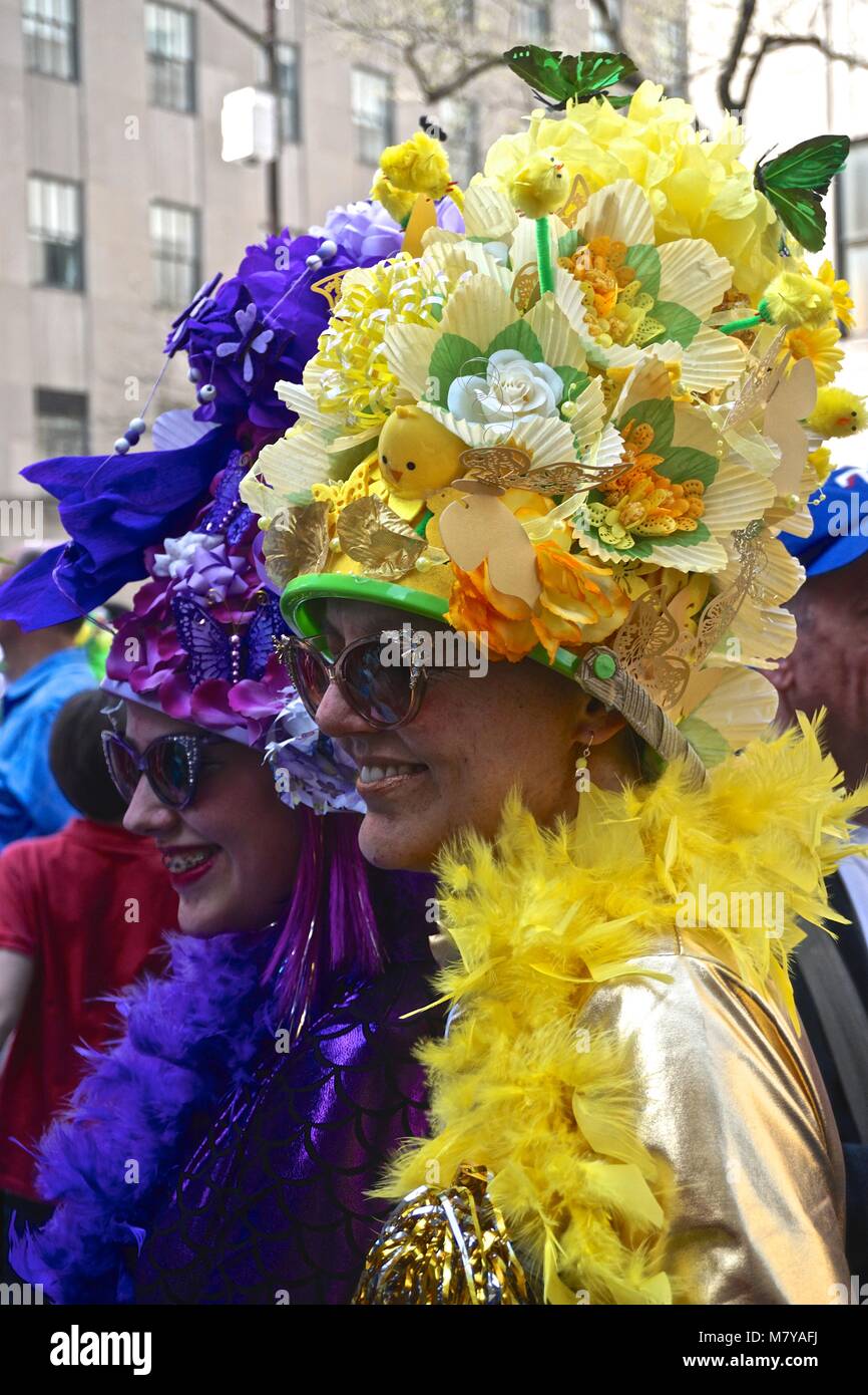 Women wearing yellow and purple Easter bonnets at the Fifth Avenue Easter  Parade in New York City Stock Photo - Alamy