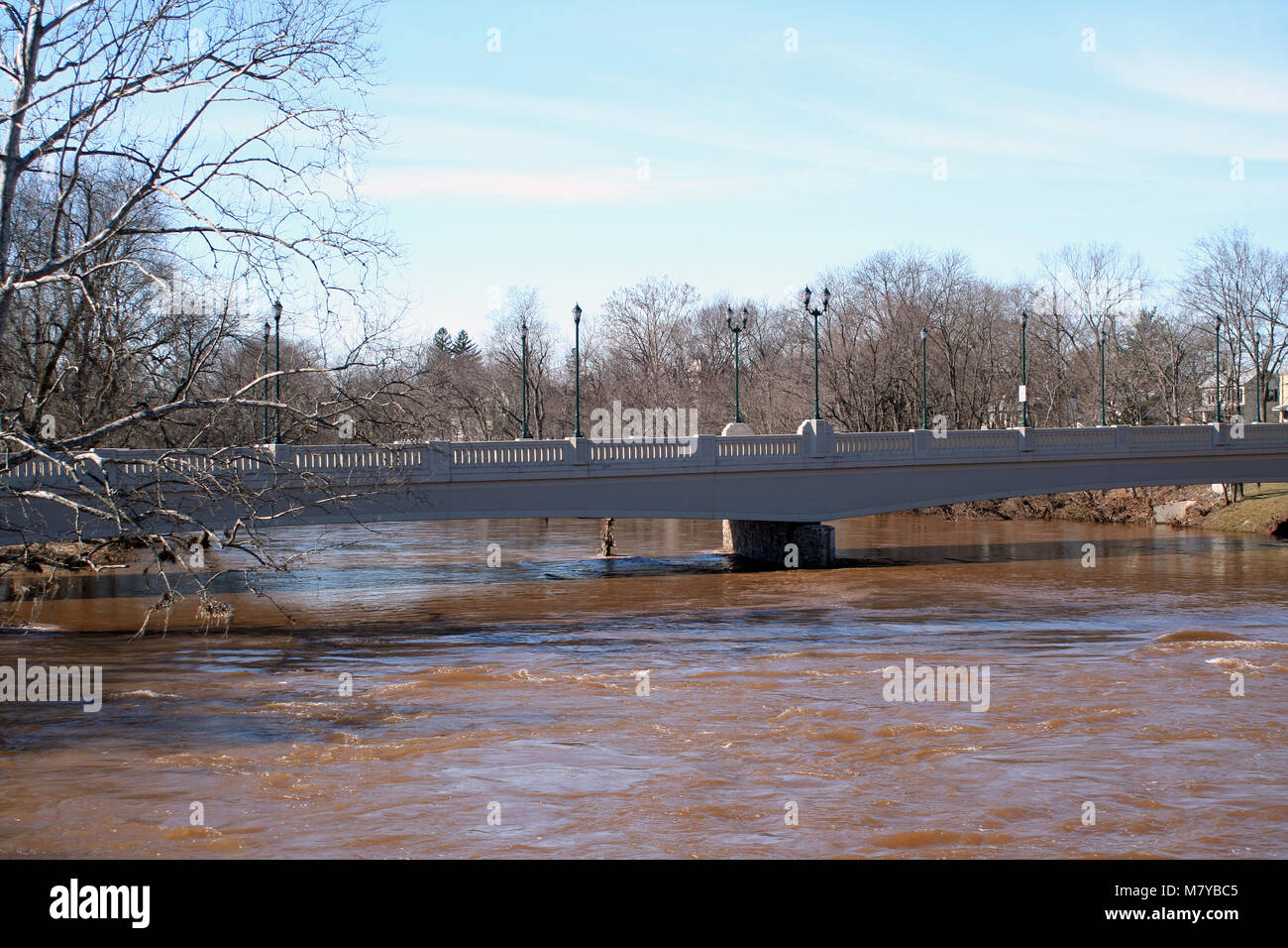 A Bridge over rising flood waters Stock Photo