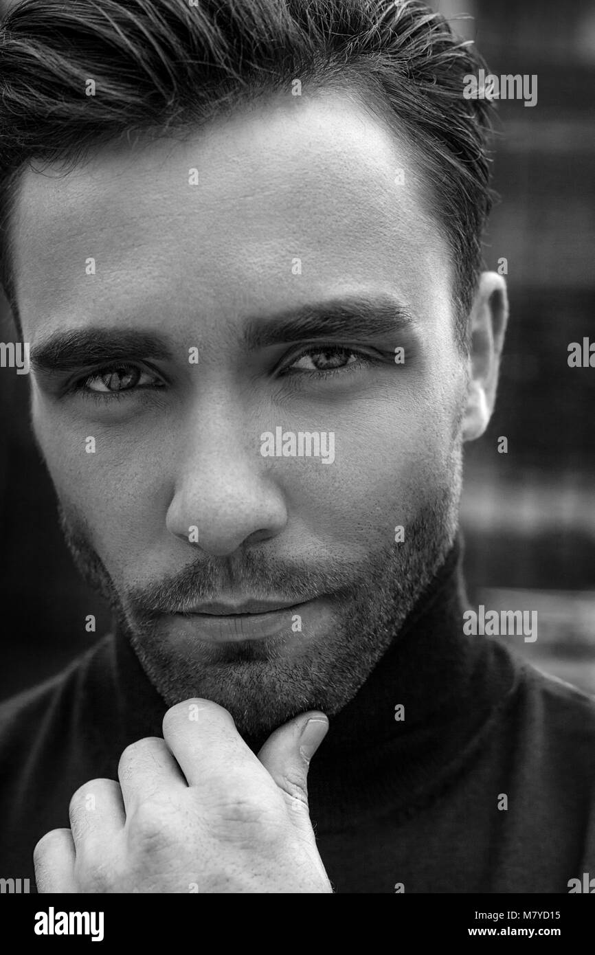 black and white handsome male model posing and looking to the camera Stock Photo