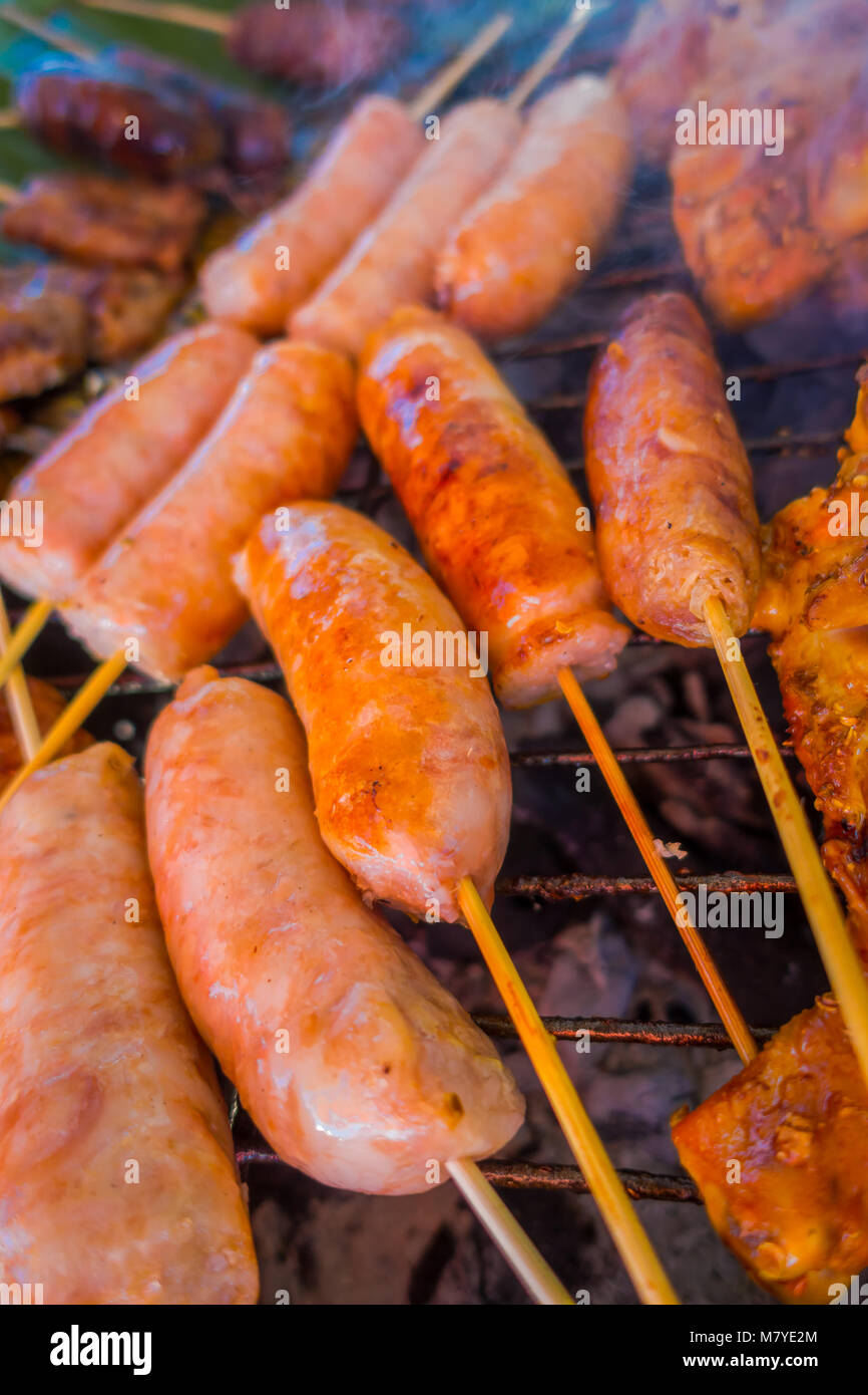 Close up of sausage brochette at street food in Chiang Mai in Thailand Stock Photo