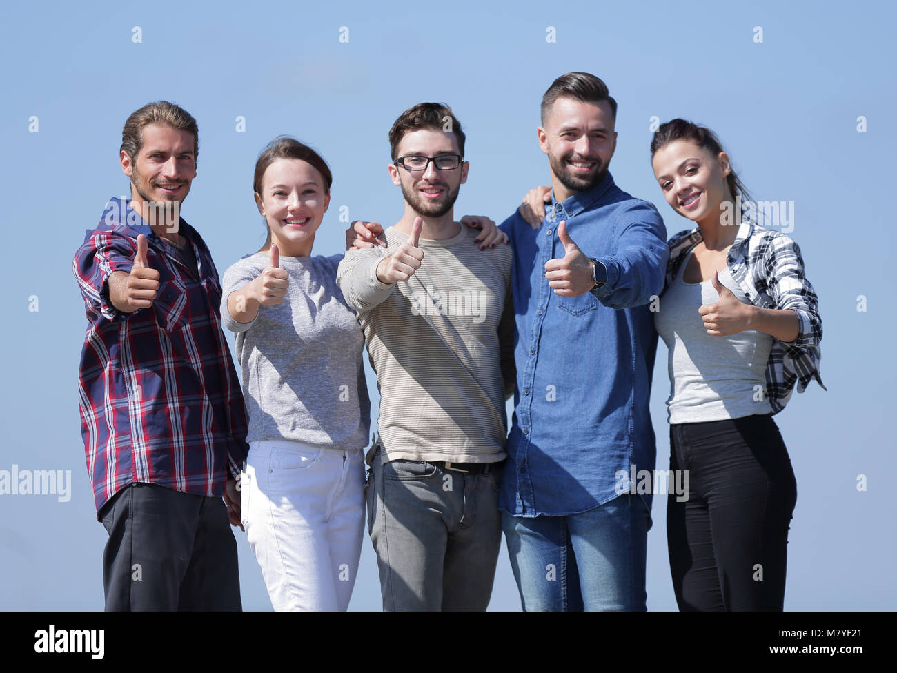group of young people showing thumb up Stock Photo - Alamy