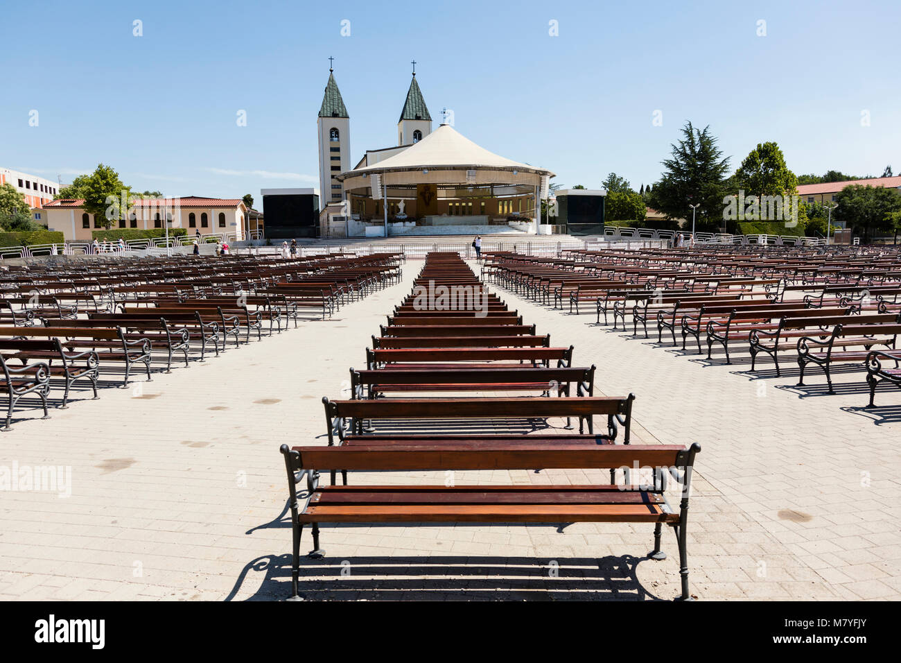 Medjugorje, Bosnia and Herzegowina, July 15 2017: Saint James Church with wooden benches in Medjugorje is a popular destination for pilgrims Stock Photo