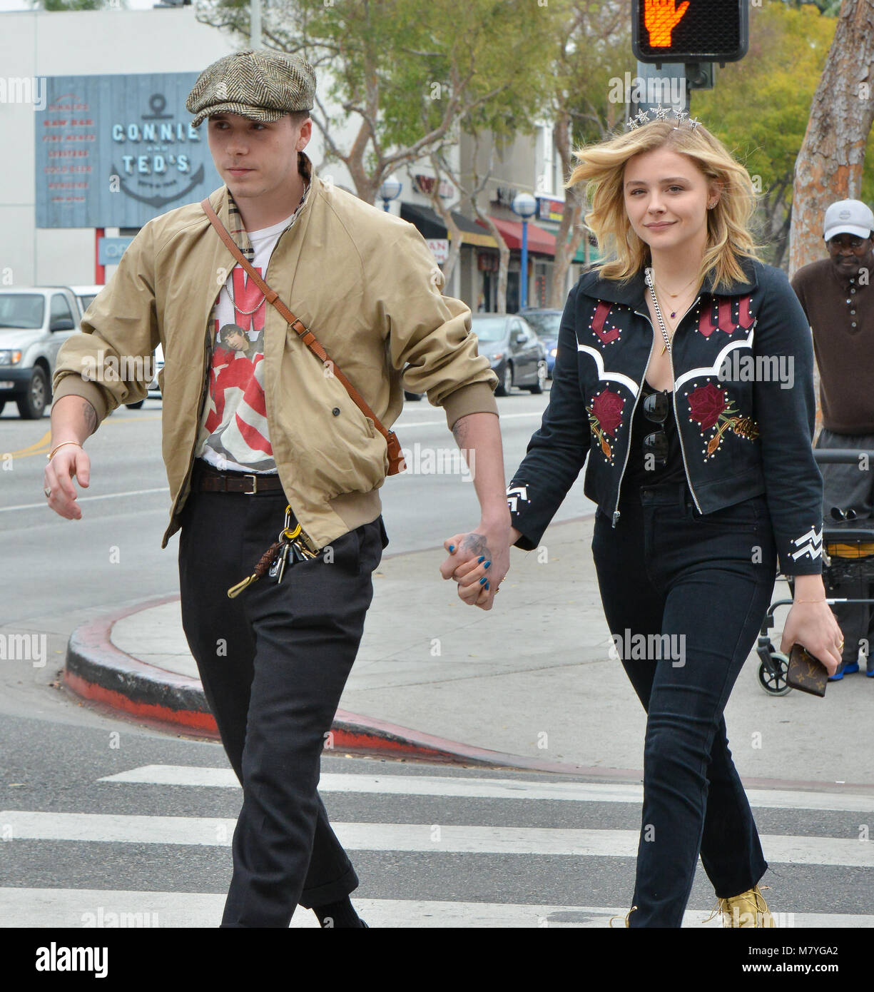 Chloe Grace Moretz and Brooklyn Beckham hold hands while picking up iced  coffee in southern California