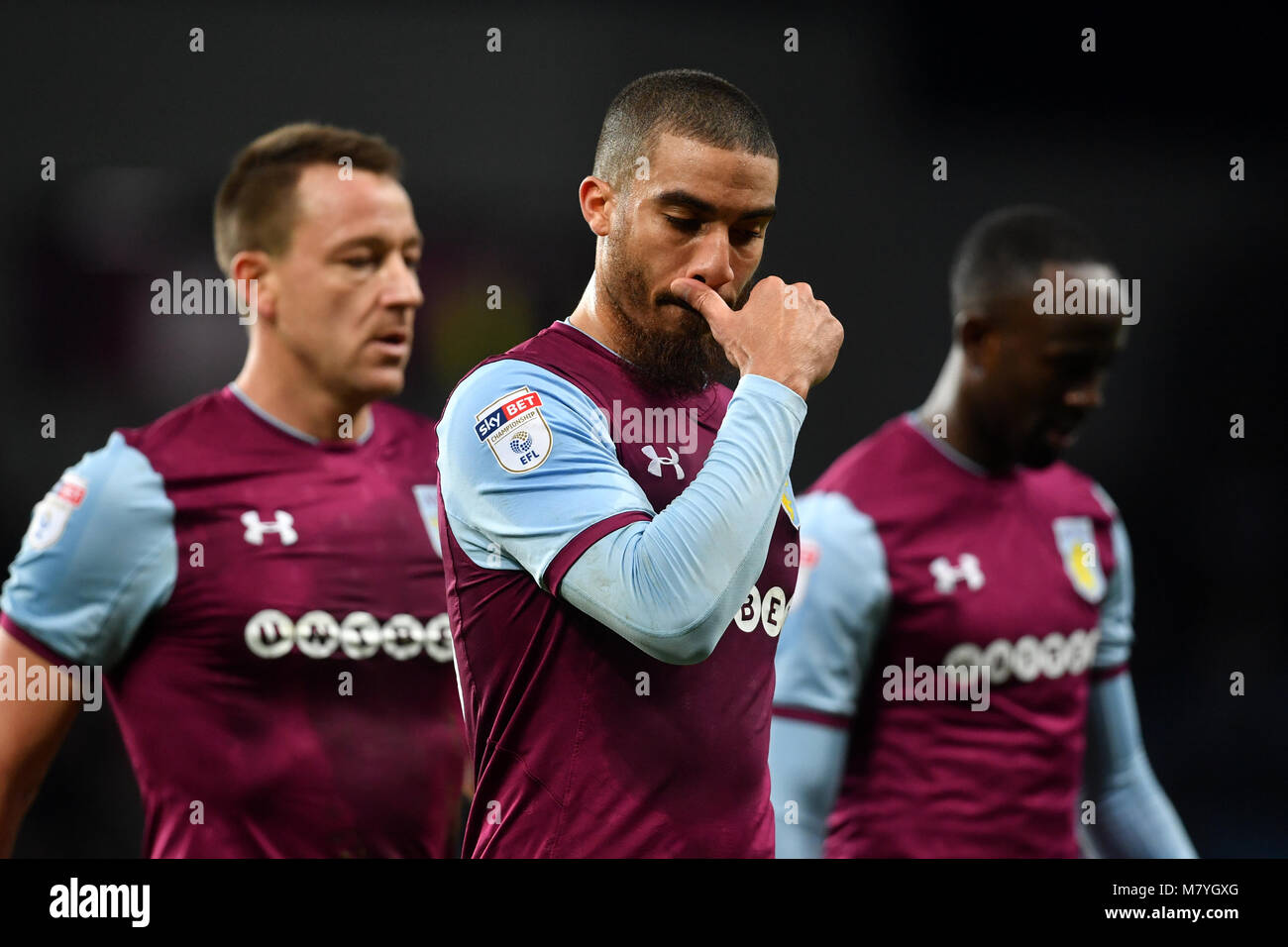 Aston Villa's (left to right) John Terry, Lewis Grabban and Albert Adomah leave the field dejected at halftime during the Sky Bet Championship match at Villa Park, Birmingham. Stock Photo