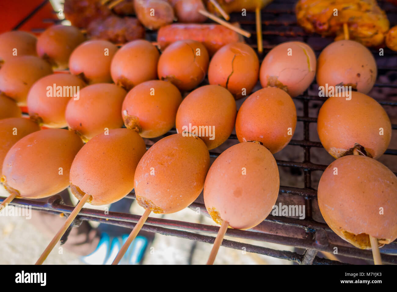 Close up of grilled eggs at street food in Chiang Mai in Thailand Stock Photo