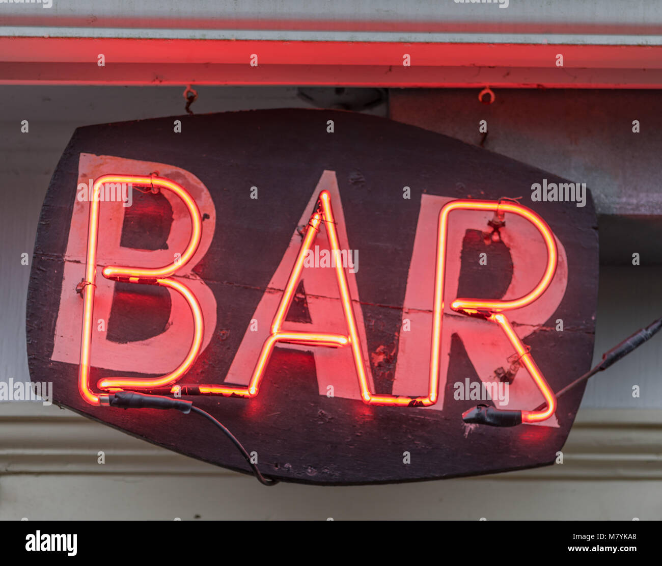 red neon sign that spells out bar in long island, ny Stock Photo
