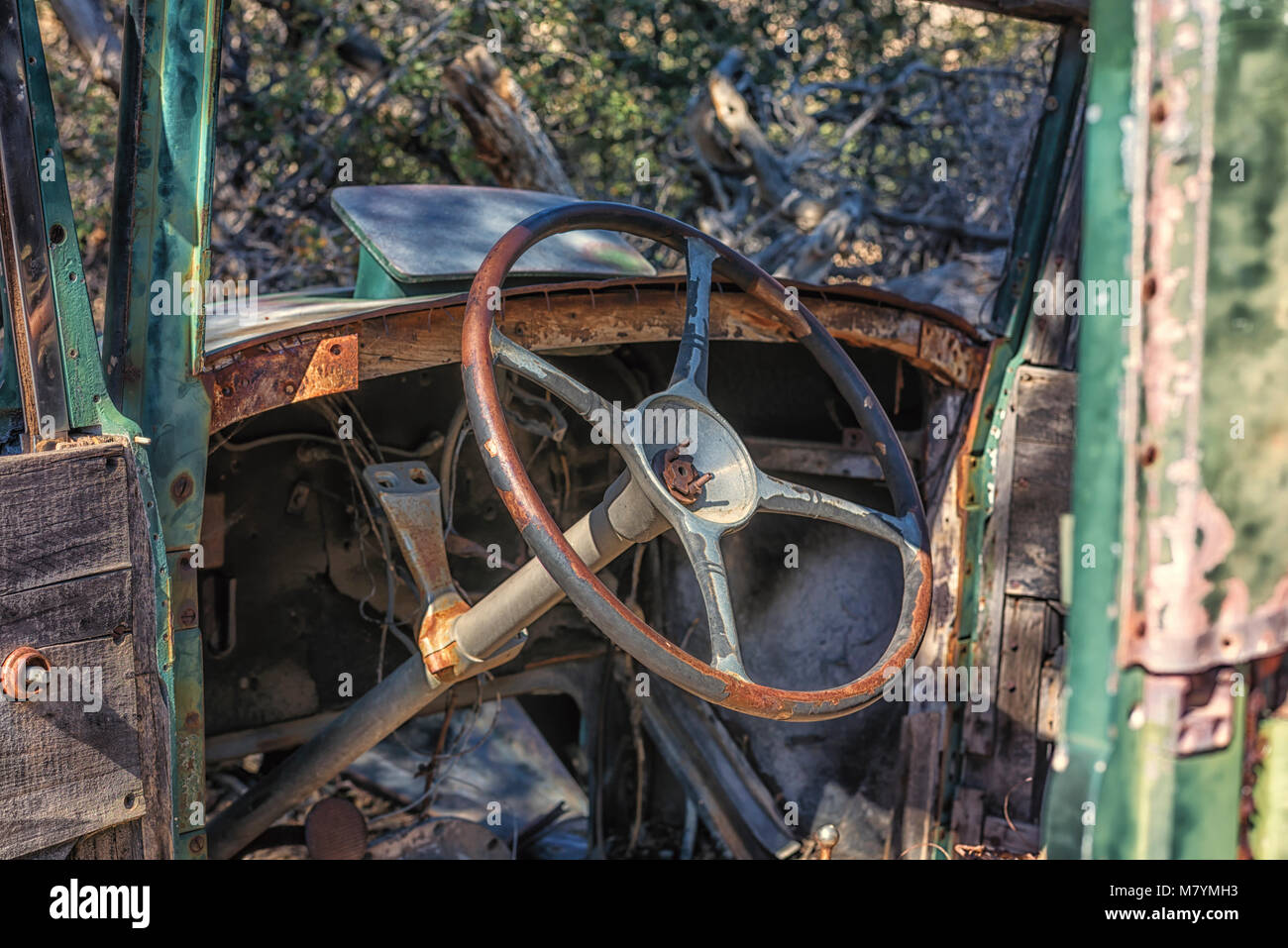 Close up of a steering wheel of an old, abandoned car in the desert.  Joshua Tree National Park, California, USA. Stock Photo