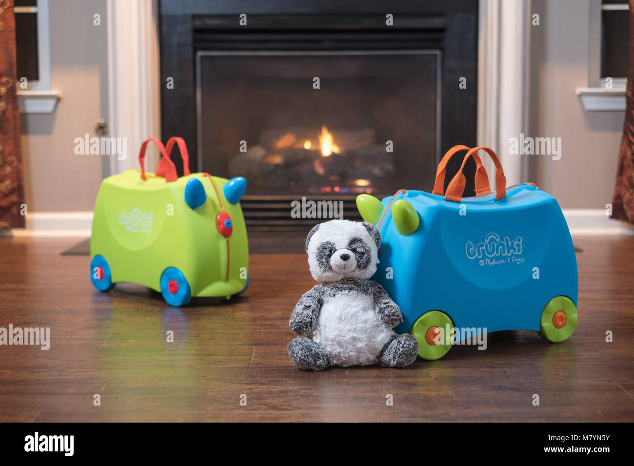 Trunki Ride-On Suitcase In Front of Home Fireplace Stock Photo