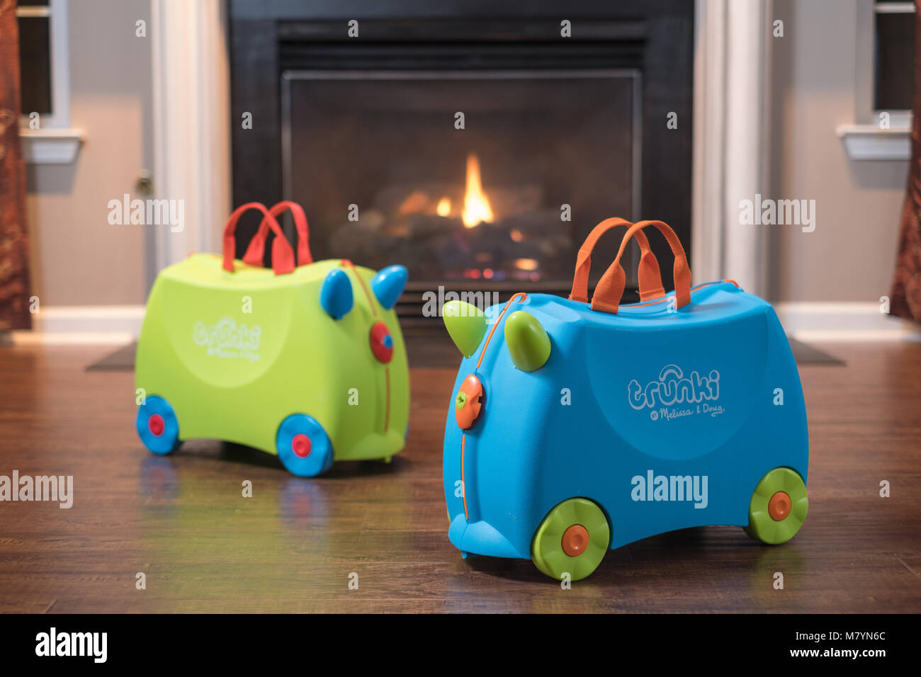 Trunki Ride-On Suitcase In Front of Home Fireplace Stock Photo