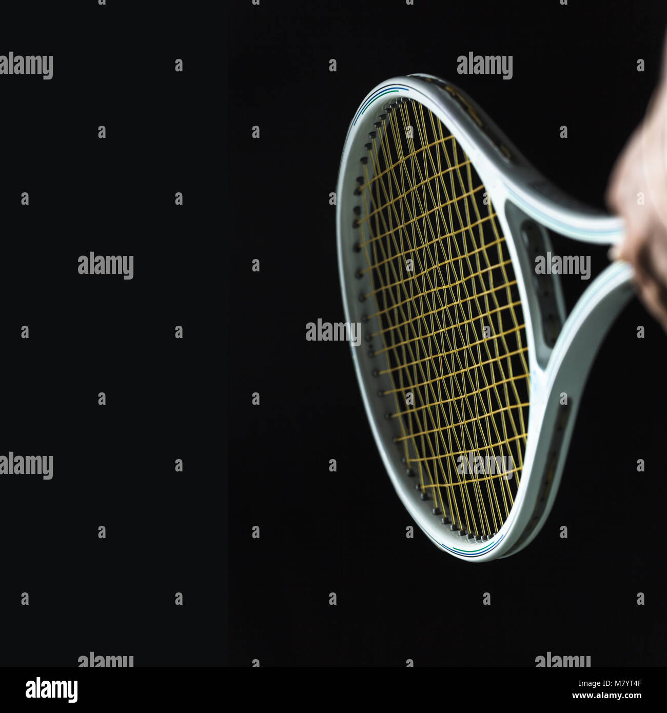 Tennis racket on black background Stock Photo - Alamy