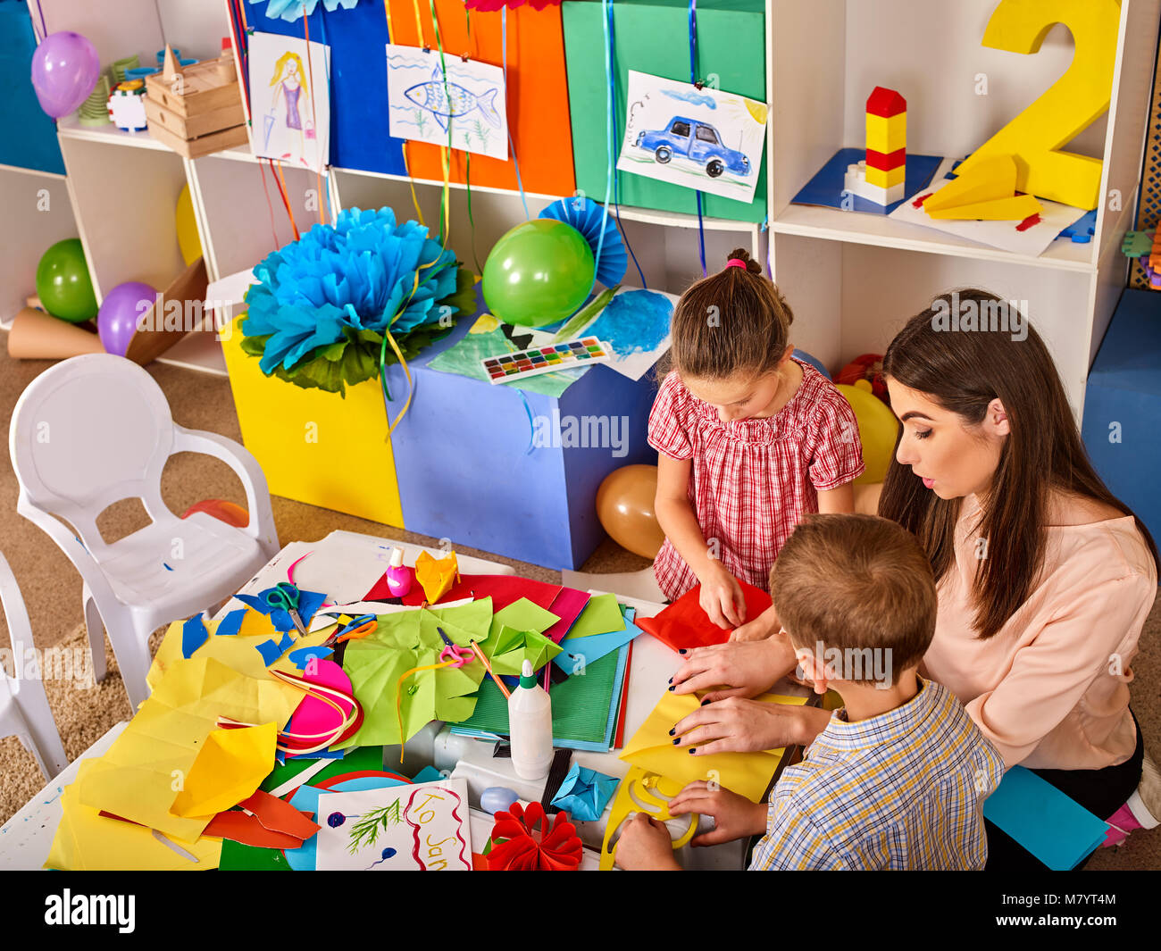 Small students with teacher painting in art school class Stock Photo ...