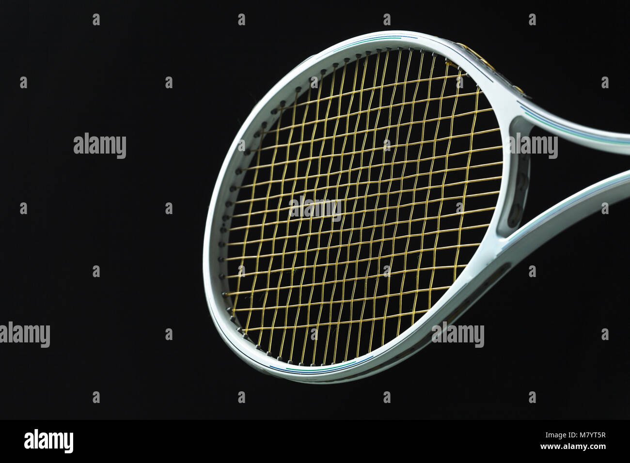 Tennis racket on black background Stock Photo - Alamy