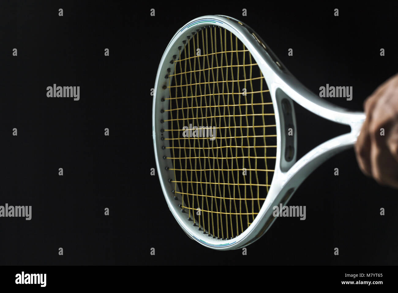 Tennis racket on black background Stock Photo - Alamy