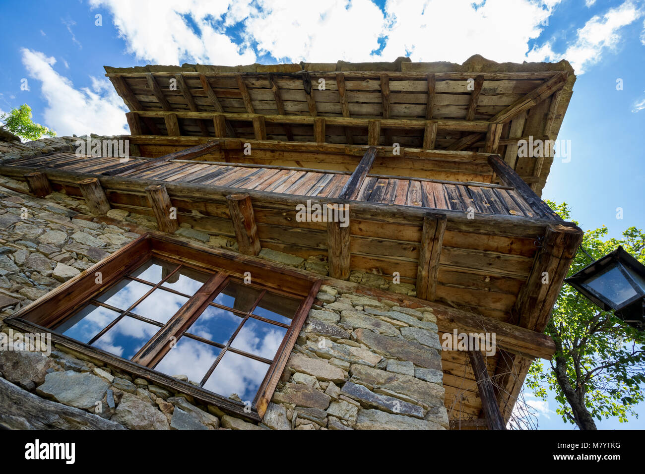 Window Cloud Reflections Old Stone And Wood House Stock Photo