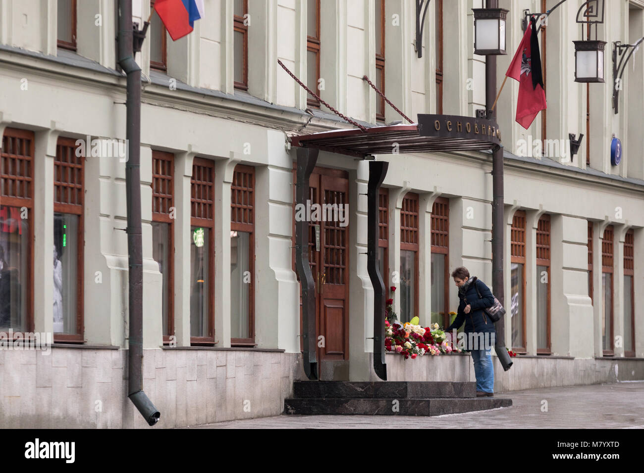 Moscow, Russia. 13th March 2018. People bring flowers to the portrait of Oleg Tabakov near the main entrance to the Moscow Art Theater; its artistic director, Russian actor Oleg Tabakov, died on March 12 in Moscow on the 83rd year of life, after a prolonged illness. Credit: Victor Vytolskiy/Alamy Live News Stock Photo