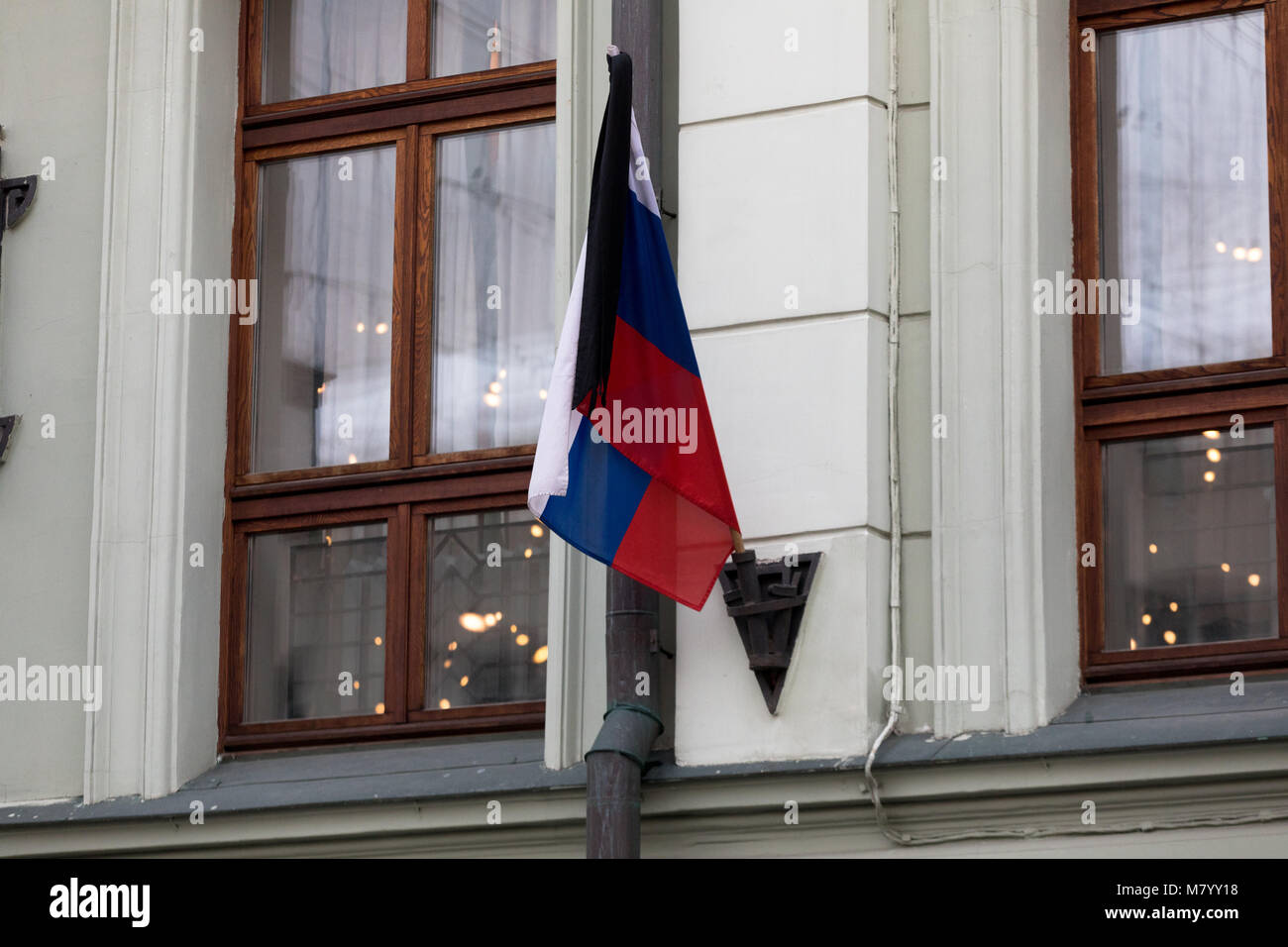 Moscow, Russia. 13th March 2018. Flag of Russia with a mourning ribbon on the facade of the building Moscow Art Theater; its artistic director, Russian actor Oleg Tabakov, died on March 12 in Moscow on the 83rd year of life, after a prolonged illness. Credit: Victor Vytolskiy/Alamy Live News Stock Photo