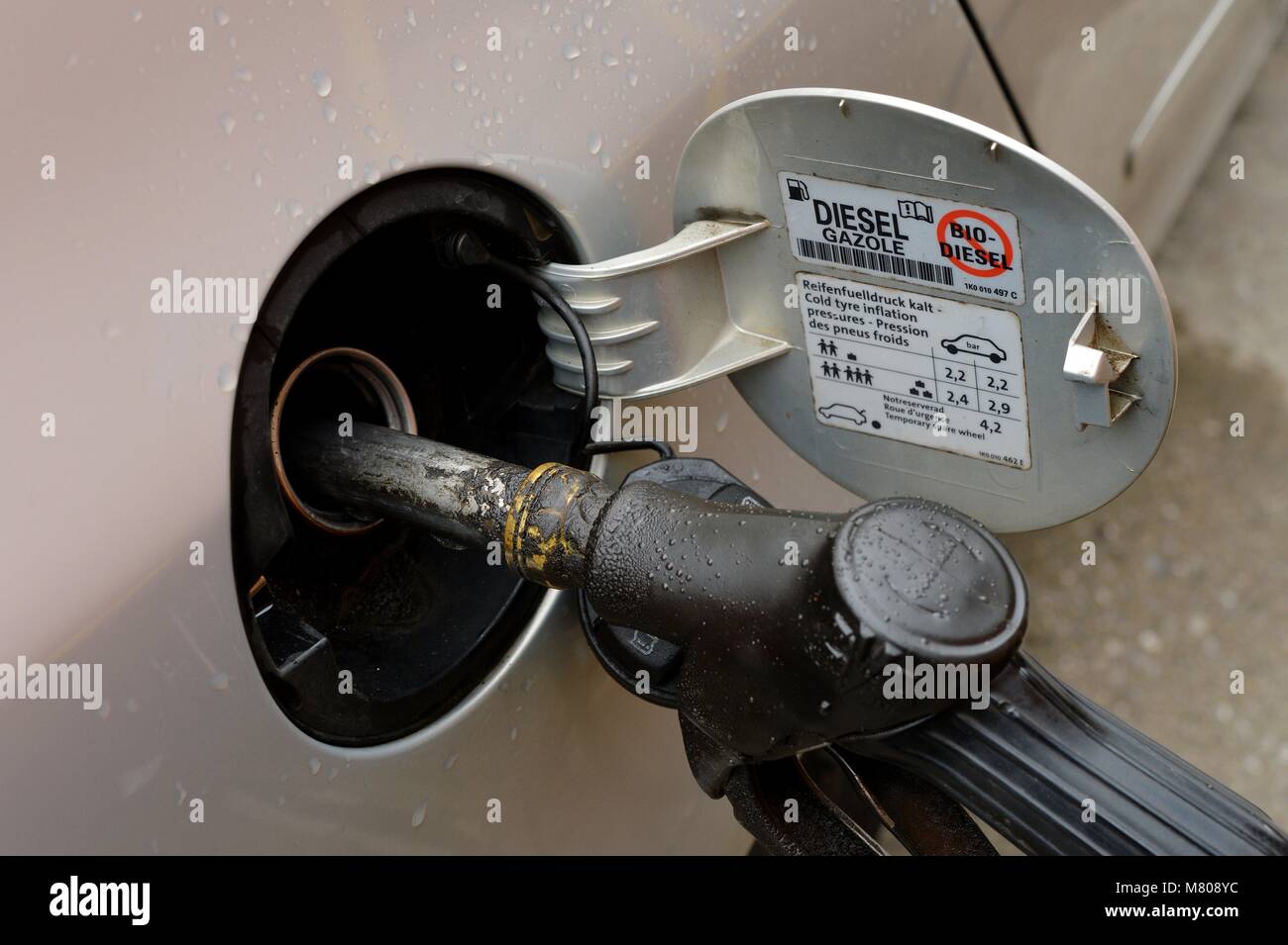Illustration Diesel car is getting gas, Germany, city of Osterode, 14