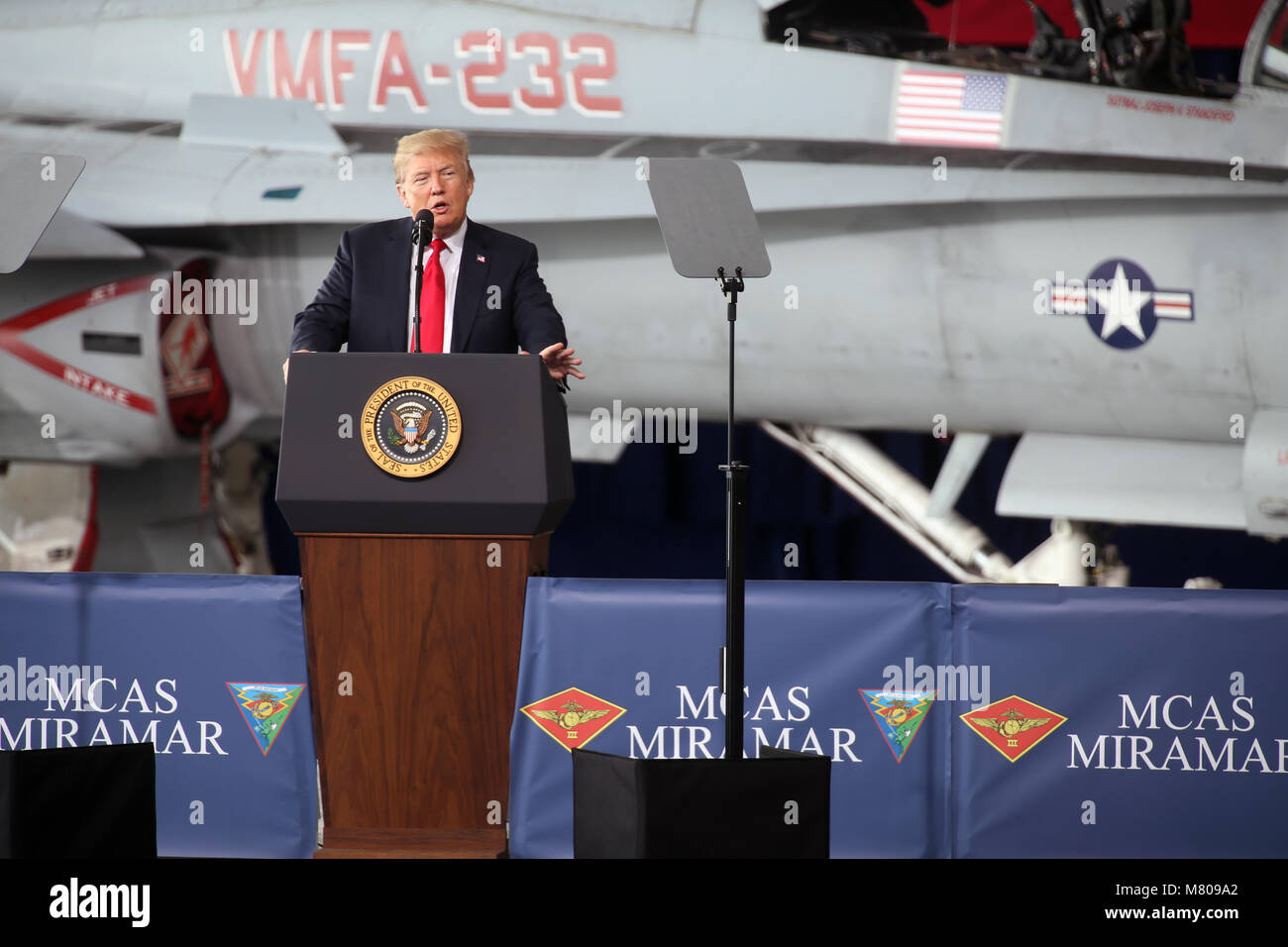 U.S President Donald Trump addresses troops during a stop at Marine Corps Air Station Miramar March 13, 2018 in Miramar, California. Trump made a quick day trip to California, his first since becoming president. Stock Photo