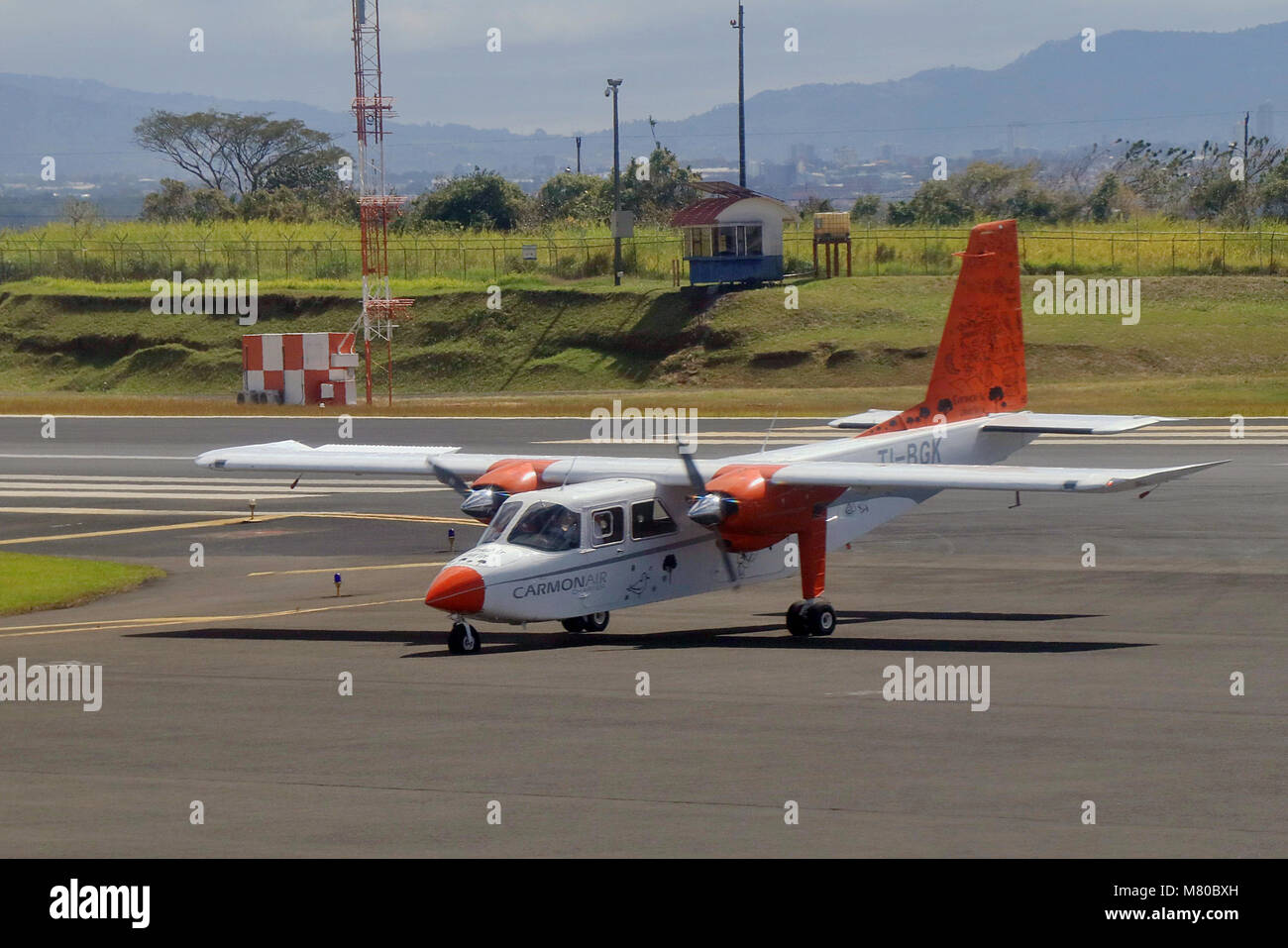 Carmonair light aircraft gets a flat tire as it is about to take off at San Jose Juan Santamaria Airport in Costa Rica causing it to abort takeoff. Stock Photo