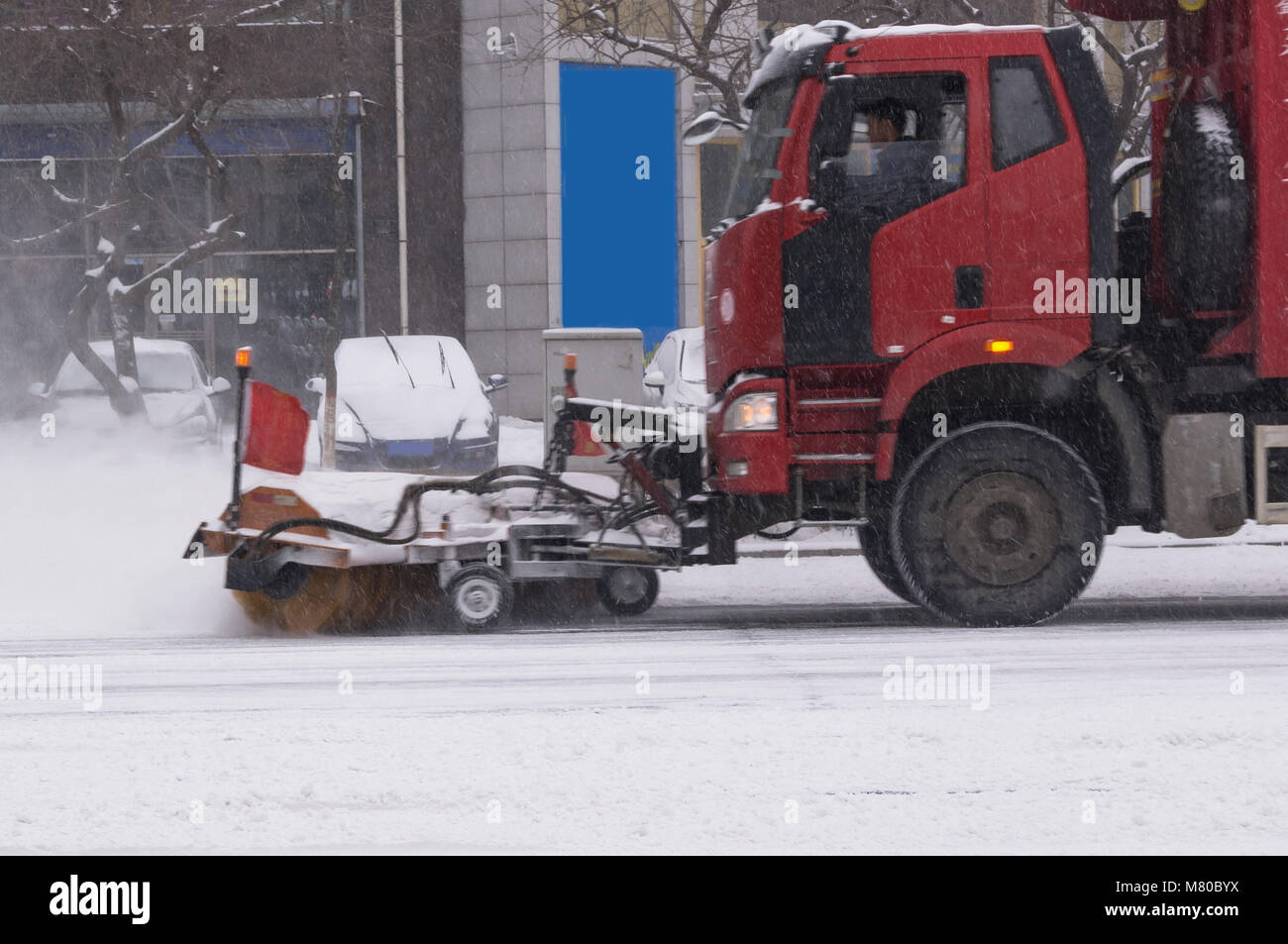Snow cleaning in the city. Special machine. Stock Photo