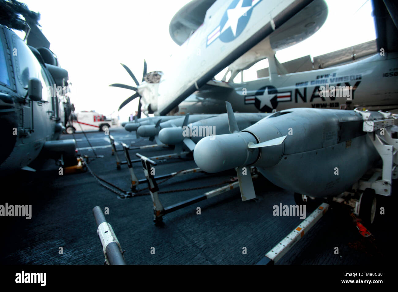 Northrop Grumman E-2 Hawkeye and MH-60S Seahawk land in USS Carl Vinson Stock Photo