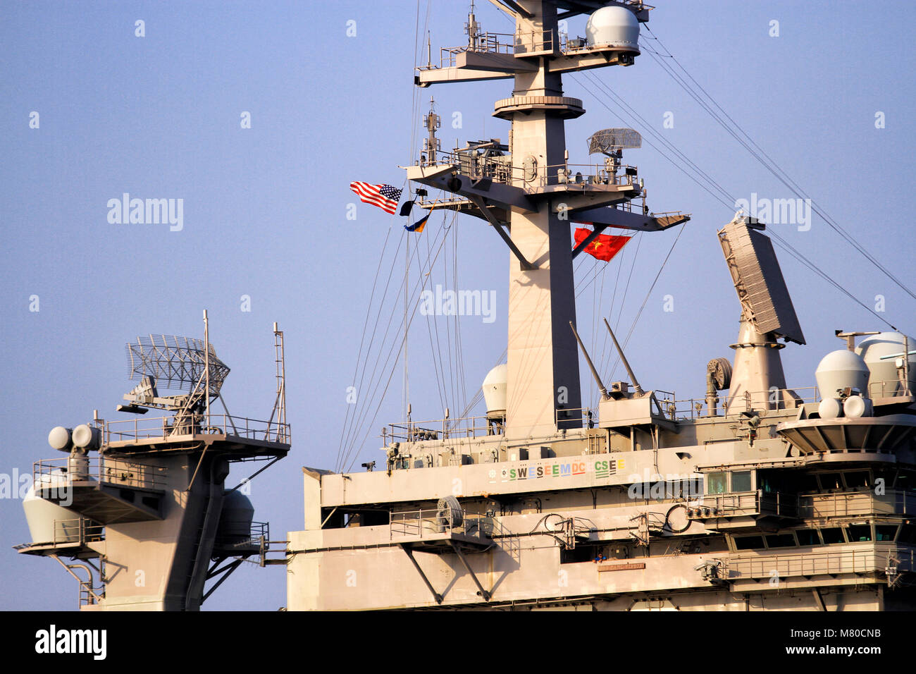 Northrop Grumman E-2 Hawkeye and MH-60S Seahawk land in USS Carl Vinson Stock Photo