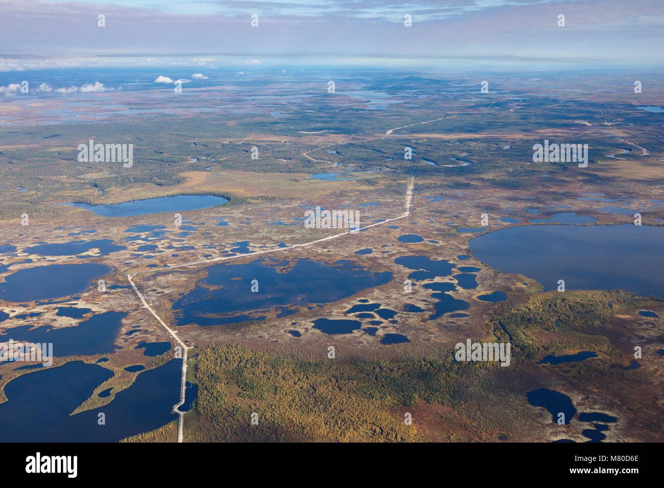 Top view of gas pipeline in endless swamps in tundra Stock Photo