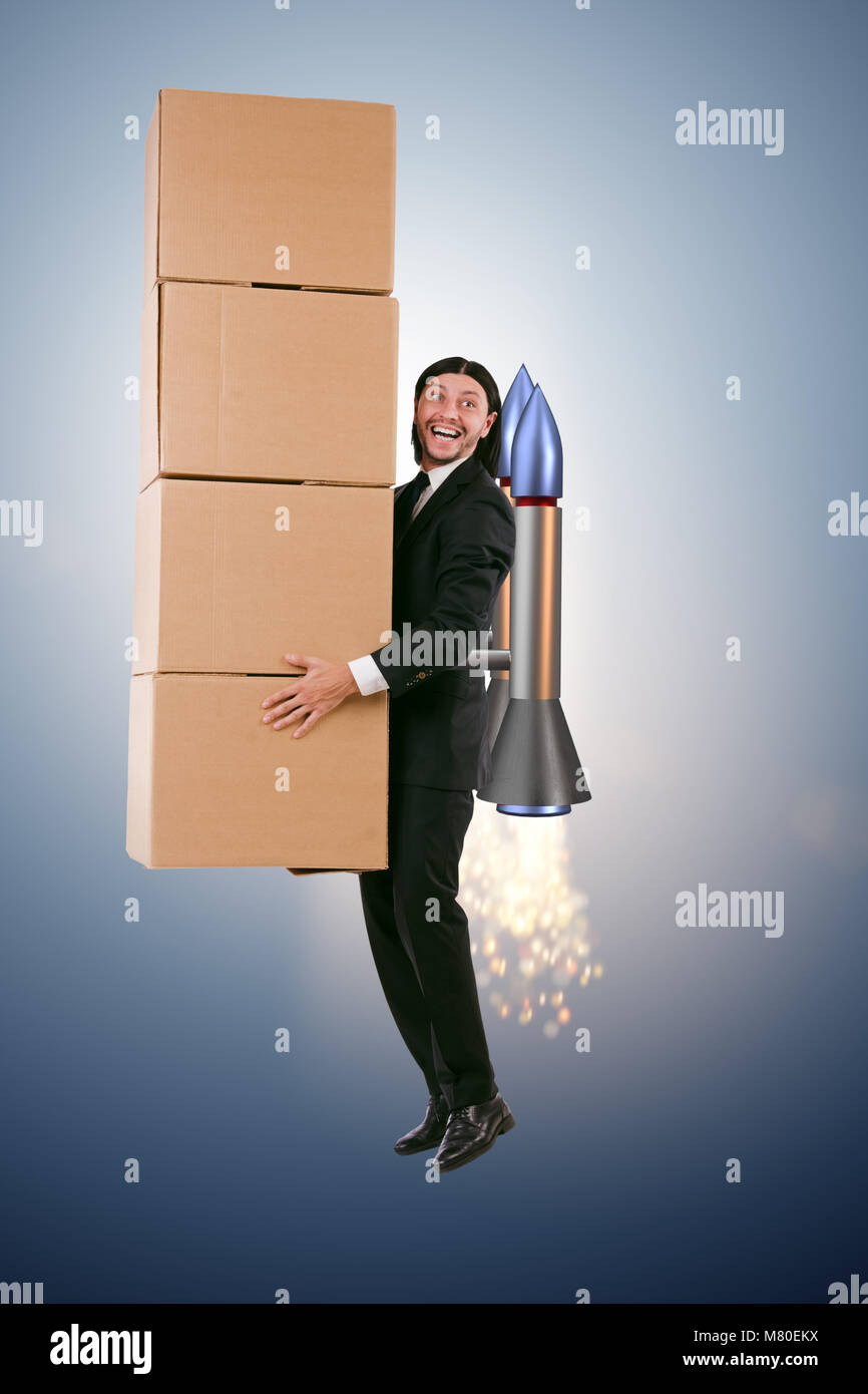 Businessman with jetpack delivering boxes globally Stock Photo - Alamy