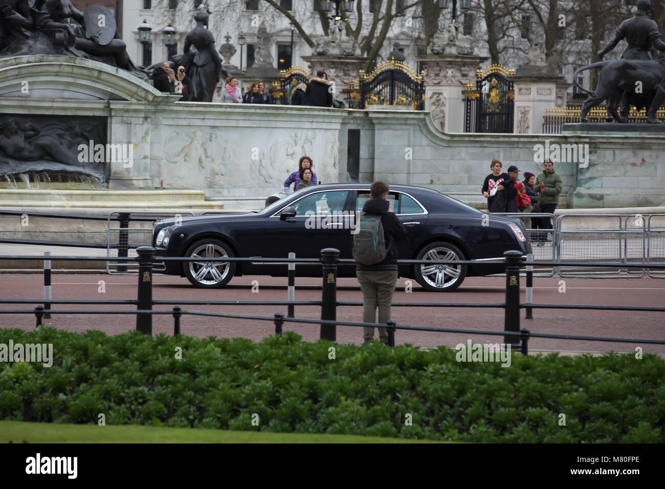 Cars containing members of the Royal Family leave Buckingham Palace the