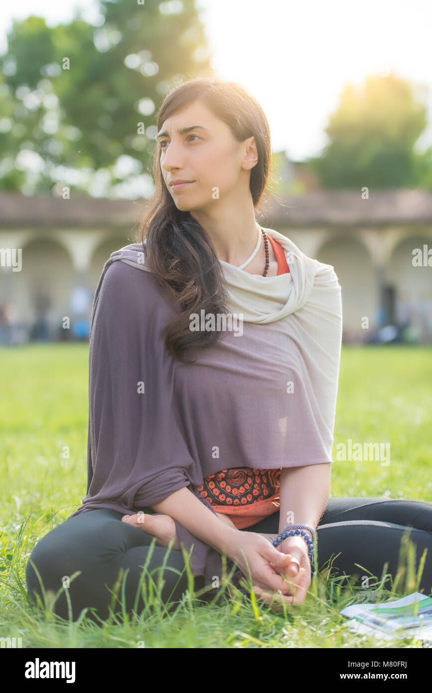 Student girl sitting in the school lawn Stock Photo - Alamy