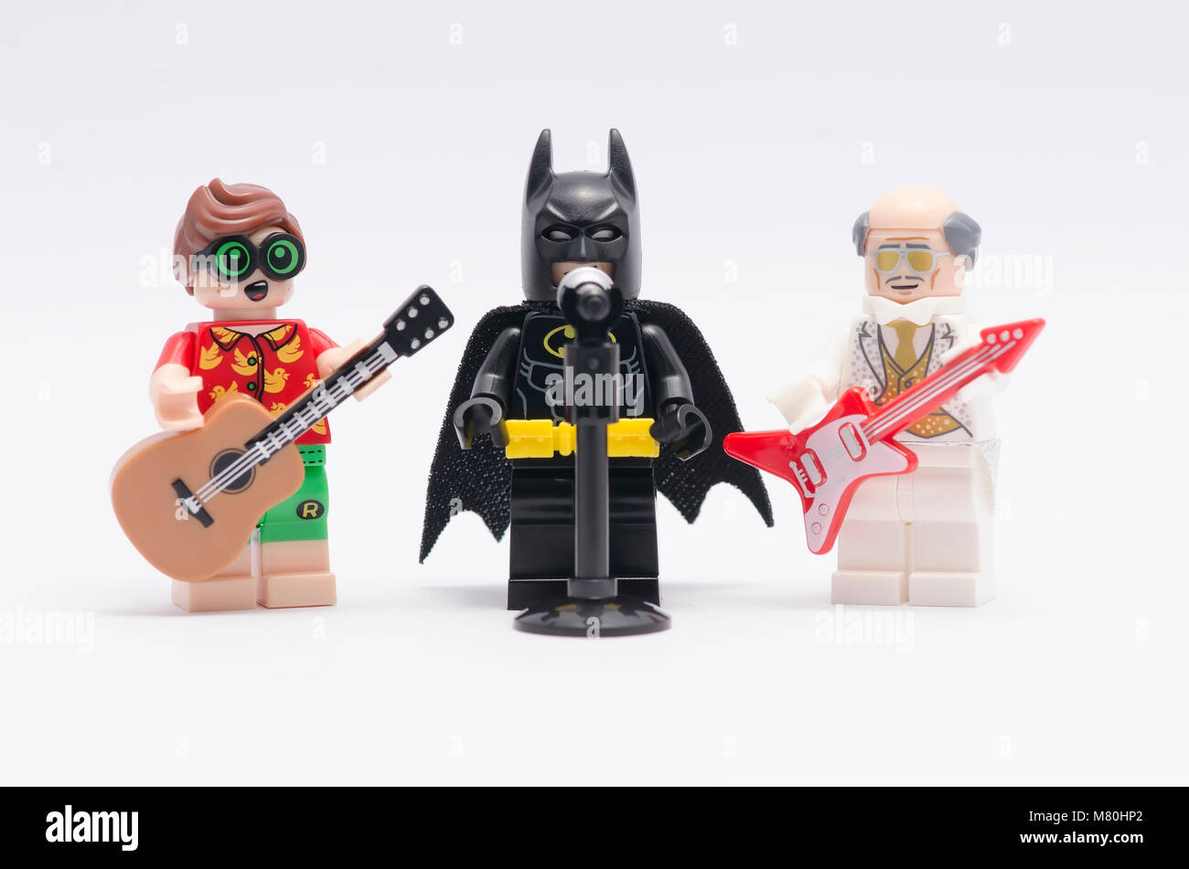 lego batman singing with alfred and robin play the guitar. isolated on white background Stock Photo Alamy