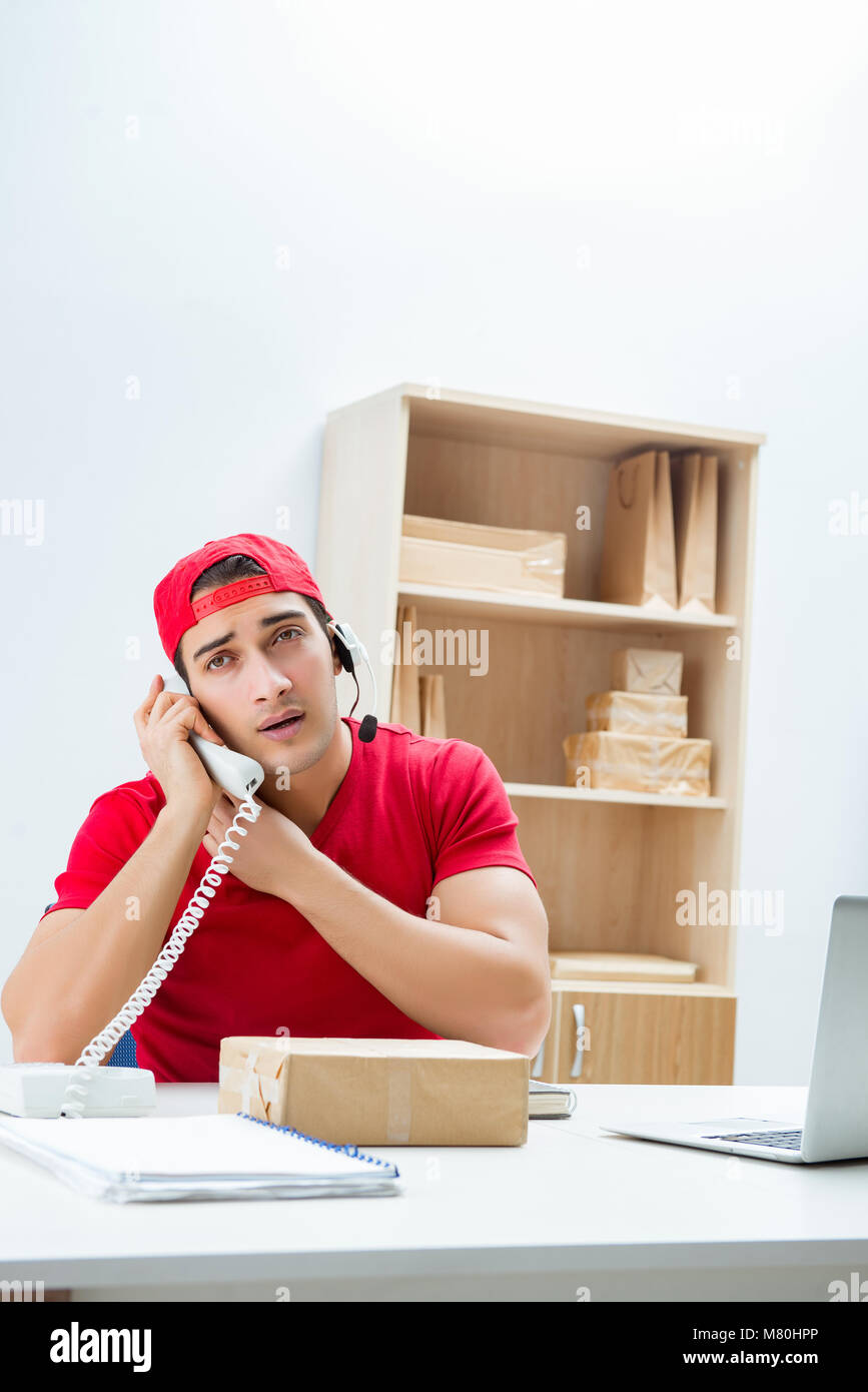 Call center worker at parcel distribution center in post office Stock ...