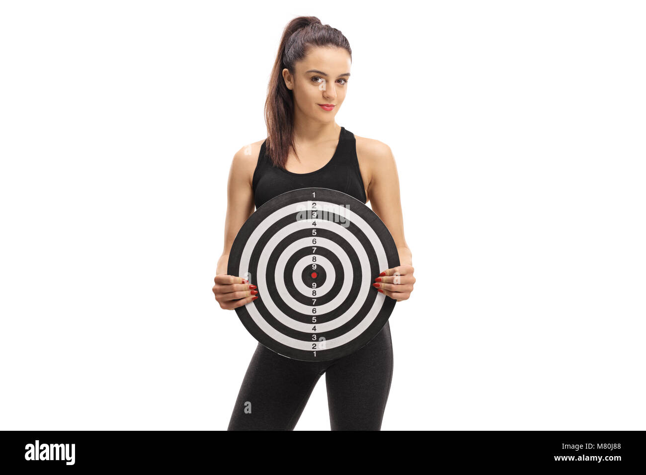 Fitness woman holding a target isolated on white background Stock Photo