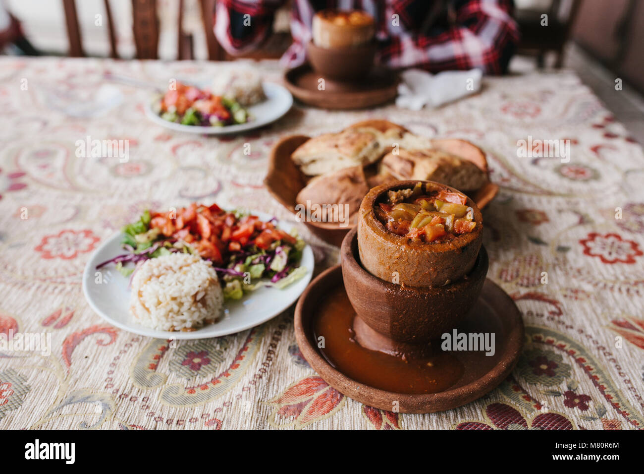 The national Turkish dish in the pot that is broken before use is called Testi-kebab. Stock Photo