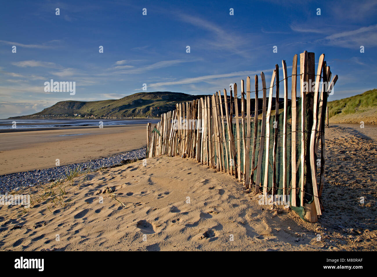 Wooden fence on the beach at Llandudno West Shore, North Wales coast Stock Photo