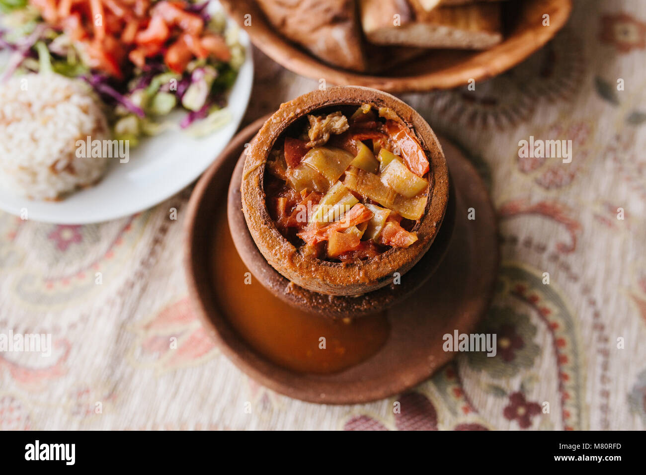 The national Turkish dish in the pot that is broken before use is called Testi-kebab. Stock Photo